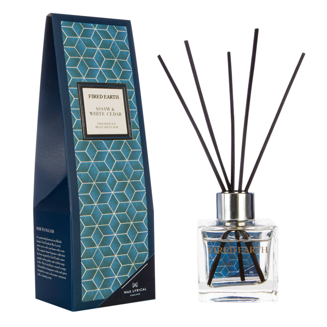 Fired Earth Reed Diffuser 100ml, Assam & White Cedar - Magnolia the Florist Leave your space feeling invigorated and inviting with this Assam and White Cedar Reed Diffuser from Wax Lyrical. Features a Fired Earth tile pattern in deep blue, this glass diffuser is filled with a captivating blend of grapefruit, golden assam, and cedarwood.  1
