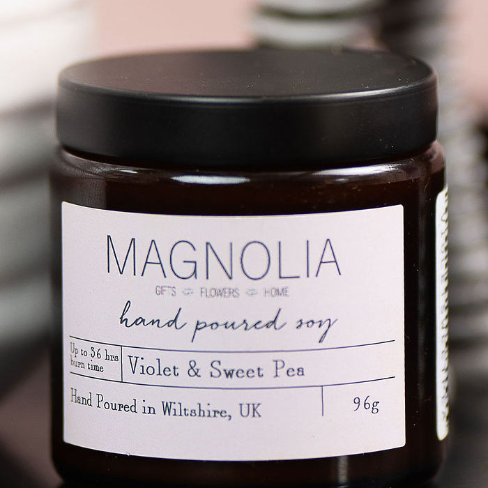 Orange, Clove and Cinnamon Scented Candle - 96g - Magnolia the Florist Indulge in the luxurious and exclusive aroma of our Orange, Clove and Cinnamon scented candle. This candle is presented in our branded, beautifully designed jar with a convenient screw-top. Embrace the warm and invigorating scents, perfect for any setting. Enjoy the aromatic benefits while enhancing any room with a touch of elegance, made with a professional blend of scented oil & emollient wax balm.  1