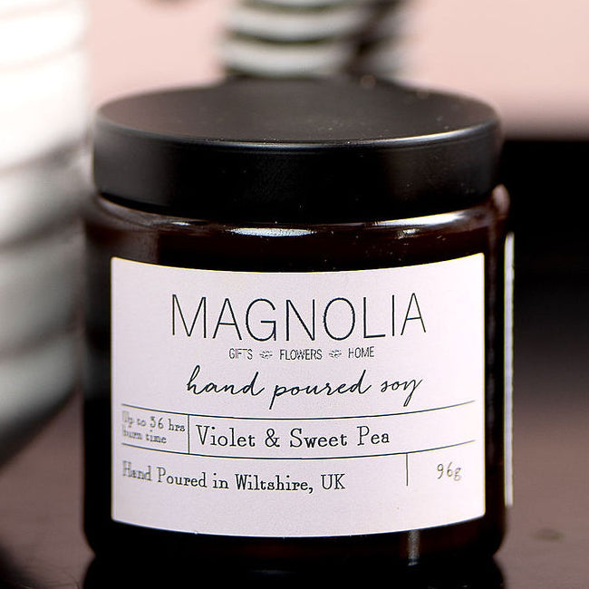 Violet & Sweet Pea Scented Candle - 96g - Magnolia the Florist Indulge in the delicate scents of violet and sweet pea with this luxurious candle. This will add an air of exclusivity to any room. Light it up and let the sophisticated aromas transport you to a world of elegance and style. Enjoy the aromatic benefits while enhancing any room with a touch of elegance, made with a professional blend of scented oil & emollient wax balm.  1