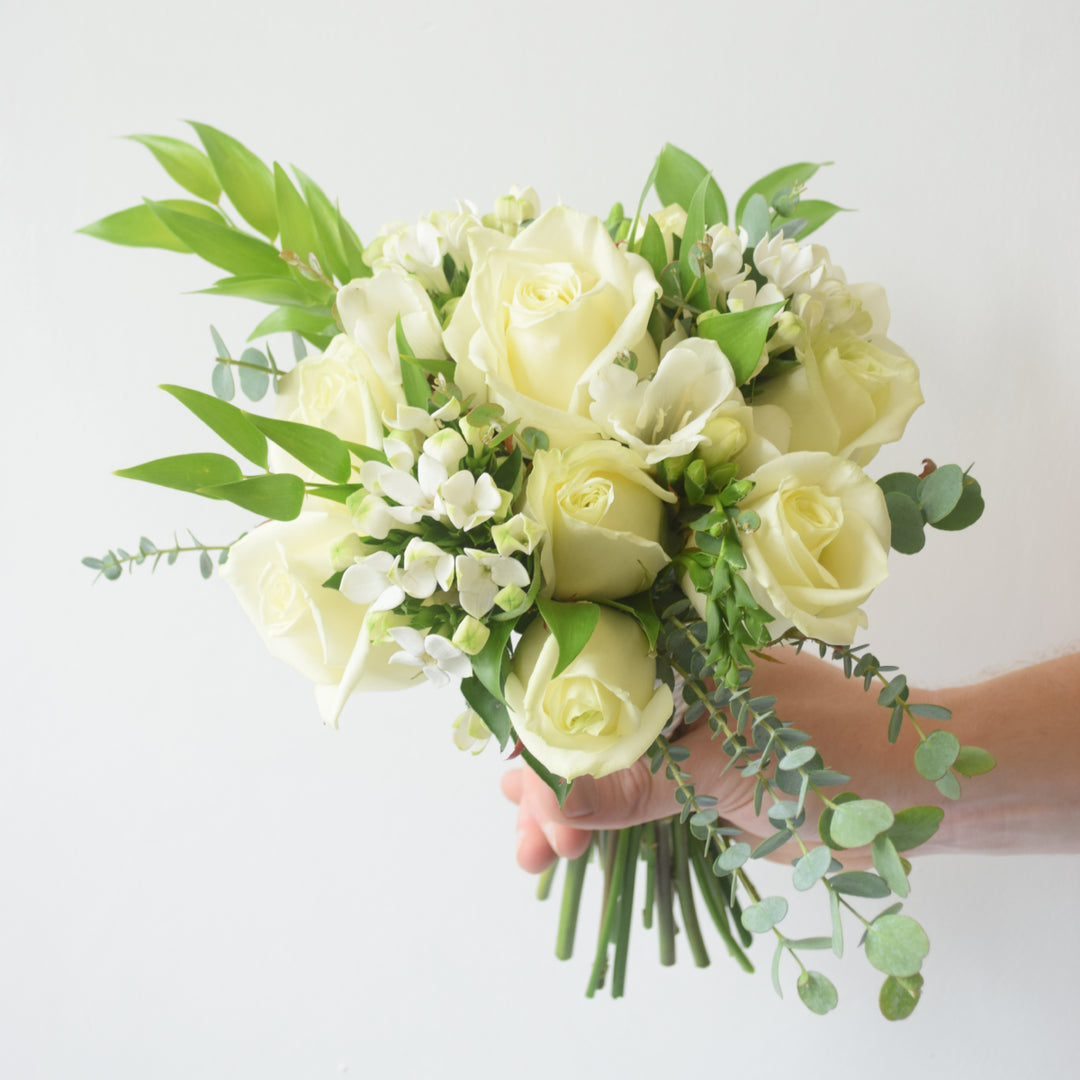Prom Presentation Posy - Magnolia the Florist Our Prom Presentation Posy is an elegant floral arrangement, thoughtfully designed by our expert florist using blooms selected to harmonise with your chosen colour palette. This bespoke posy offers a refined touch to your special evening, combining delicate textures and hues for a truly sophisticated statement.  1