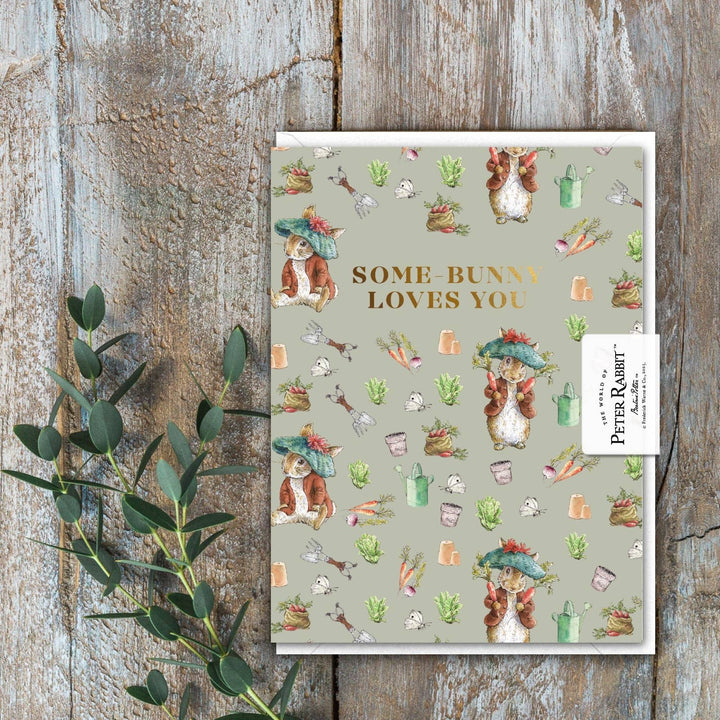 Some-Bunny Loves You (Benjamin Bunny) Card - Magnolia the Florist A sweet Benjamin Bunny mini card with a gold‑foiled message — a lovely way to add a little love to your flowers. Printed on beautifully textured, fully recyclable card. Size is 90 × 120 mm • Blank inside • Includes white envelope  2