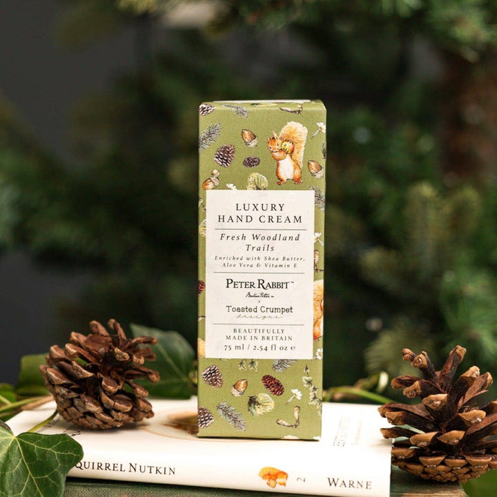 Squirrel Nutkin "Fresh Woodland Trails" Luxury Hand Cream - Magnolia the Florist Introducing the Squirrel Nutkin "Fresh Woodland Trails" Luxury Hand Cream from the Peter Rabbit Collection by Toasted Crumpet. This 75ml hand cream offers an enchanting journey into the heart of British nature. Enjoy the luxury of a moisturizing hand cream that brings the beauty of the outdoors, indoors. This product is proudly made exclusively in Britain.  2