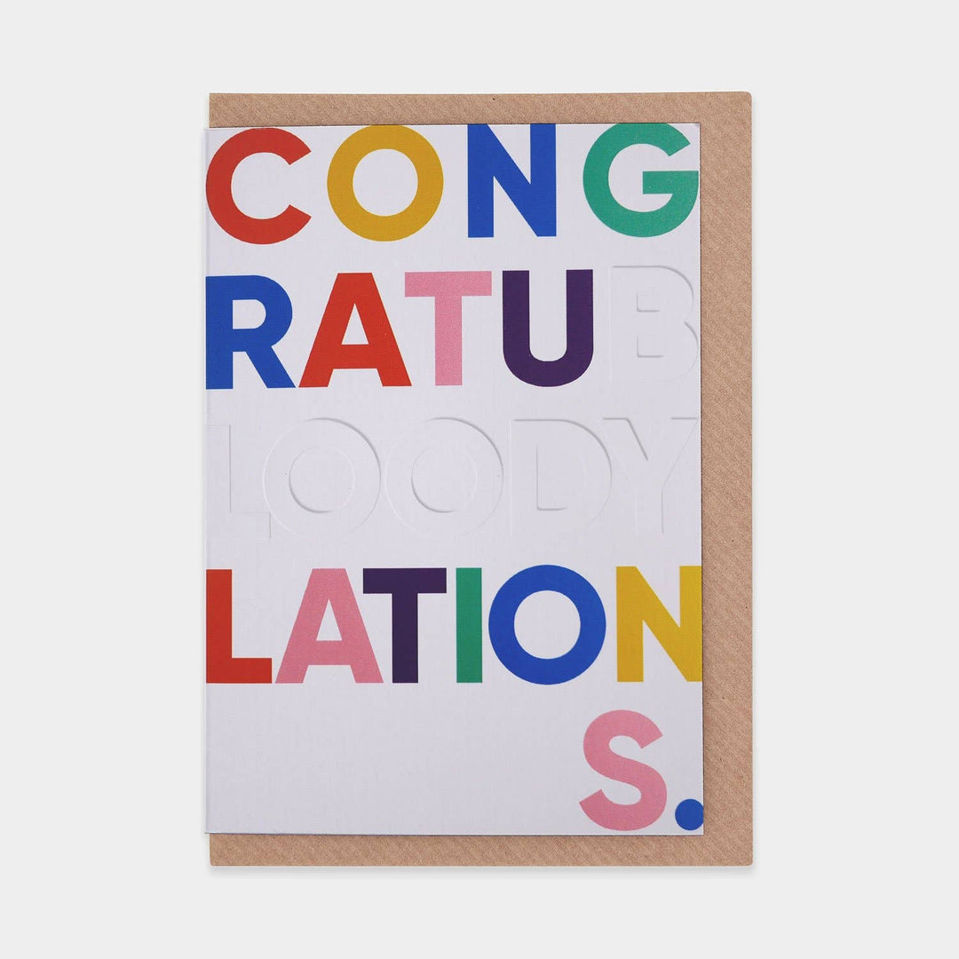 Congratubloodylations Greetings Card - Magnolia the Florist In this series titled ‘Word Play’ the idea was to create a range of typographically-inspired greetings cards designed in a playful, bold style. Word Play is an Evermade Studio project, created by our dedicated team of designers. Finished with a debossed element on the text and produced on premium matt art card. Each design is blank inside for you to compose your own message. Size: A6 (folded) 104 x 148mm Includes a brown kraft envelope  1
