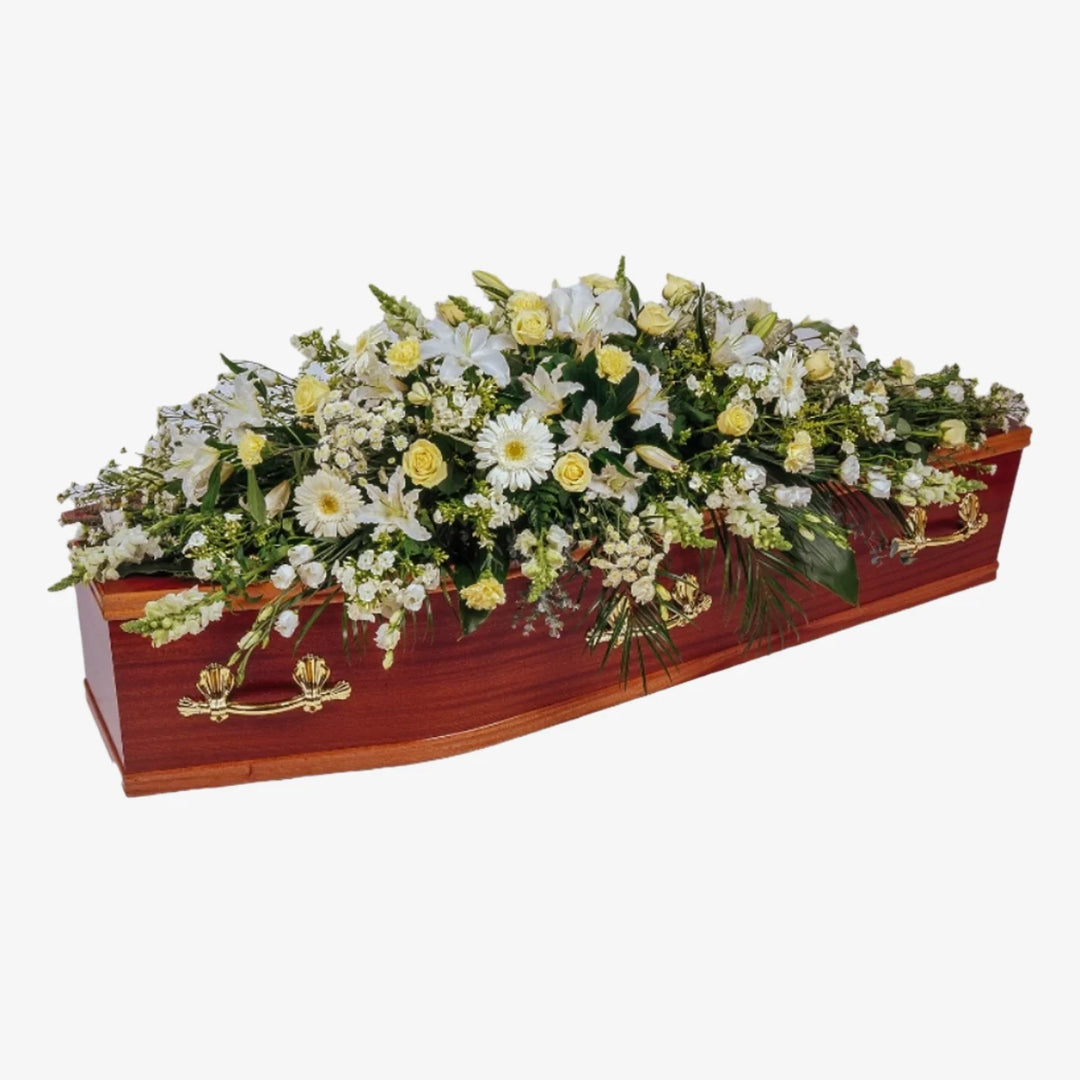 White & Cream Casket Spray - Magnolia the Florist This stunning casket spray is made from seasonal white and cream flowers and foliage. The image is an overall representation of the finished item and flower content may differ from the image shown. If you cannot find what you want on our site, please call our sales team, we're always happy to assist you. This item requires 2 days notice to order.  1