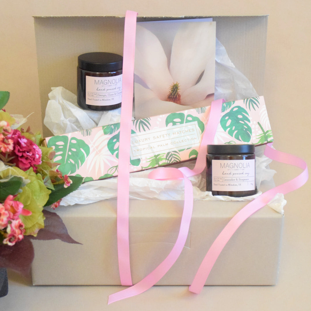 Candle & Matches Gift Set - Magnolia the Florist Indulge in the luxury of our Candle & Matches Gift Set. This exclusive selection features two hand-picked scented candles and long matches, beautifully packaged in a gift box and finished with a bow. Treat yourself or a loved one to the perfect blend of elegance and ambience.  1