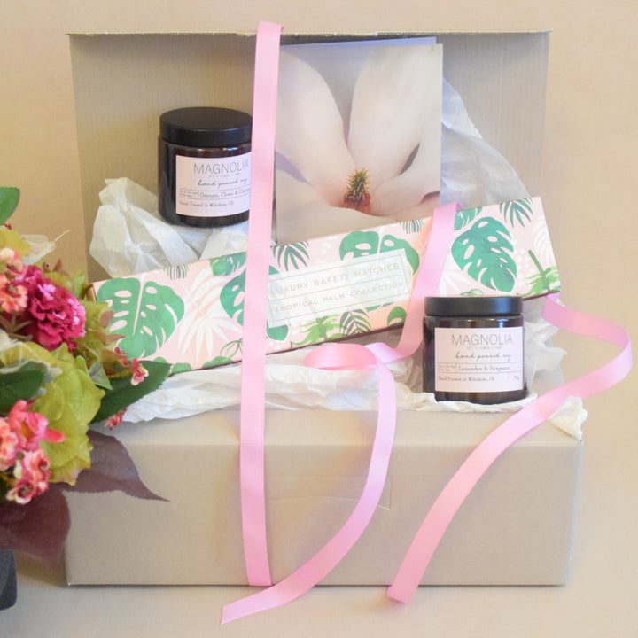 Candle &amp; Matches Gift Set - Magnolia the Florist Indulge in the luxury of our Candle &amp; Matches Gift Set. This exclusive selection features two hand-picked scented candles and long matches, beautifully packaged in a gift box and finished with a bow. Treat yourself or a loved one to the perfect blend of elegance and ambience.  1