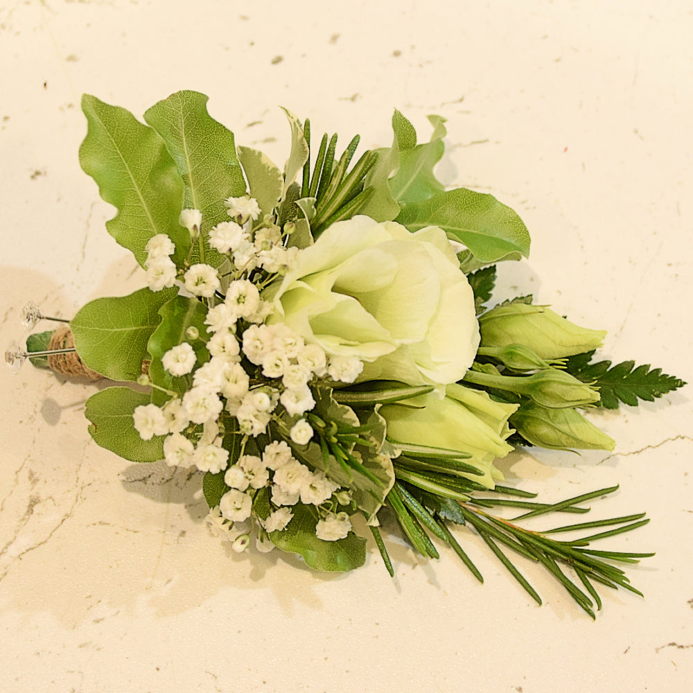 Boutonniere - Magnolia the Florist Beautiful floral accents to adorn a suit or lapel, featuring a stunning mix of textures and tones. Each boutonniere comes with an easy-pin attachment.  1