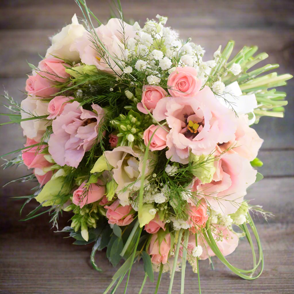 Bridesmaid Bouquet - Magnolia the Florist A petit bouquet featuring the best blooms the season has to offer. Select your colour palette and we’ll craft a stunning design just for you! Please note this item requires a minimum 1-day notice to order.  1