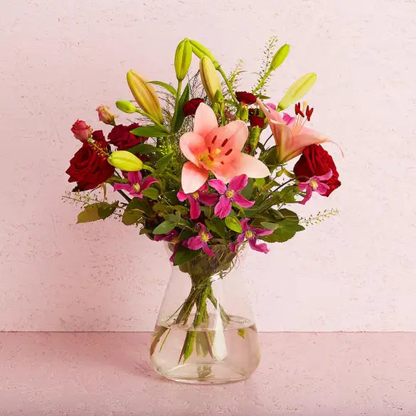 Florist Choice Vase Arrangement - Magnolia the Florist Let our talented florists put together a beautiful arrangement of flowers and will be based on the florist's favourites and the season's current flowers. The image of the arrangement is therefore indicative and the colour and flowers in this arrangement may vary. Our flowers are arranged for you tied and presented in a vase, you can personalise them with a message inside one of our gorgeous signature-style cards.  1