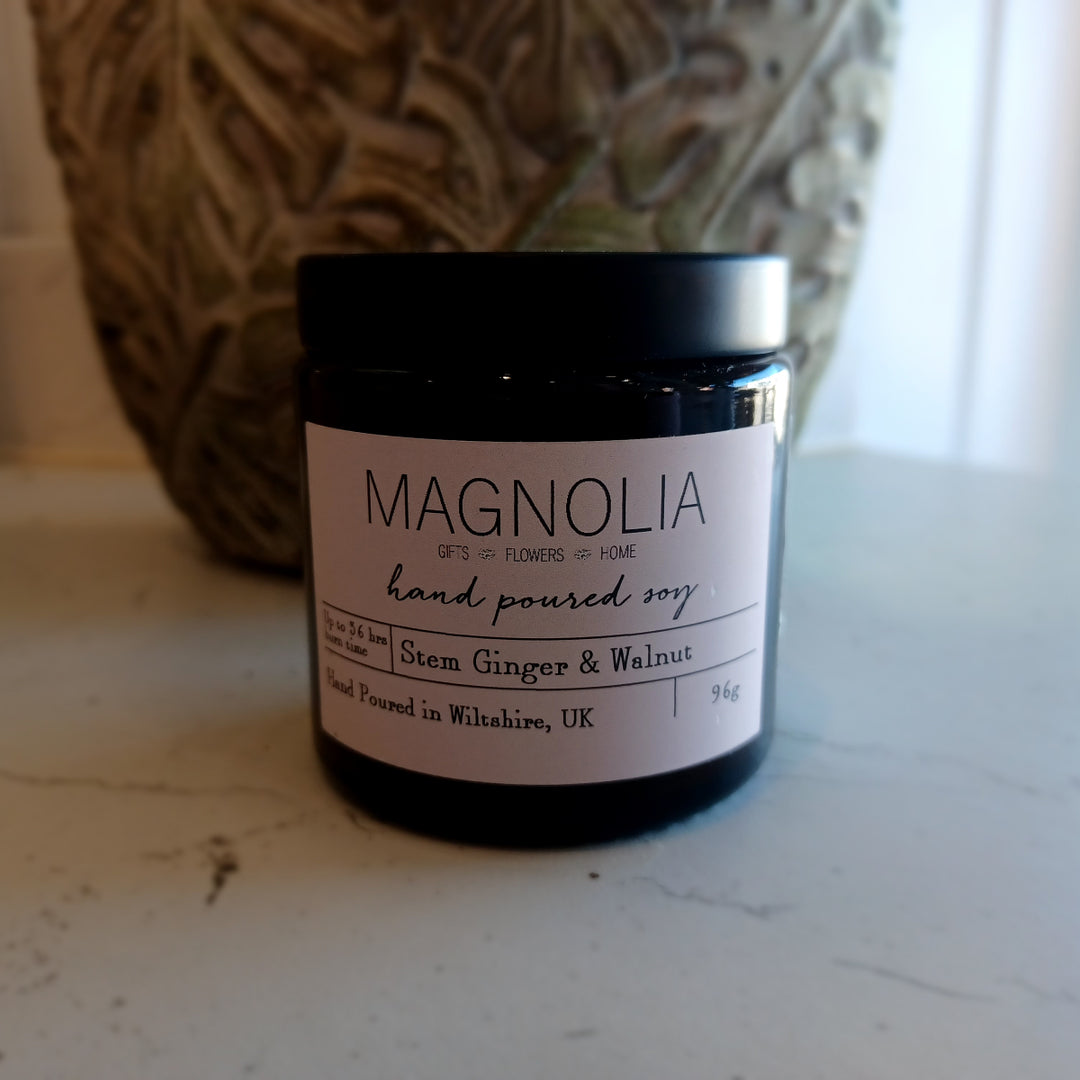 Stem Ginger & Walnut Scented Candle - 96g - Magnolia the Florist Introduce a warm and cosy atmosphere to your space with our Stem Ginger and Walnut Scented Candle. This sophisticated and long-lasting candle comes in a screw top jar for easy use and offers a delightful ginger and walnut scent that will soothe and relax your senses. Enjoy the aromatic benefits while enhancing any room with a touch of elegance, made with a professional blend of scented oil & emollient wax balm.  1