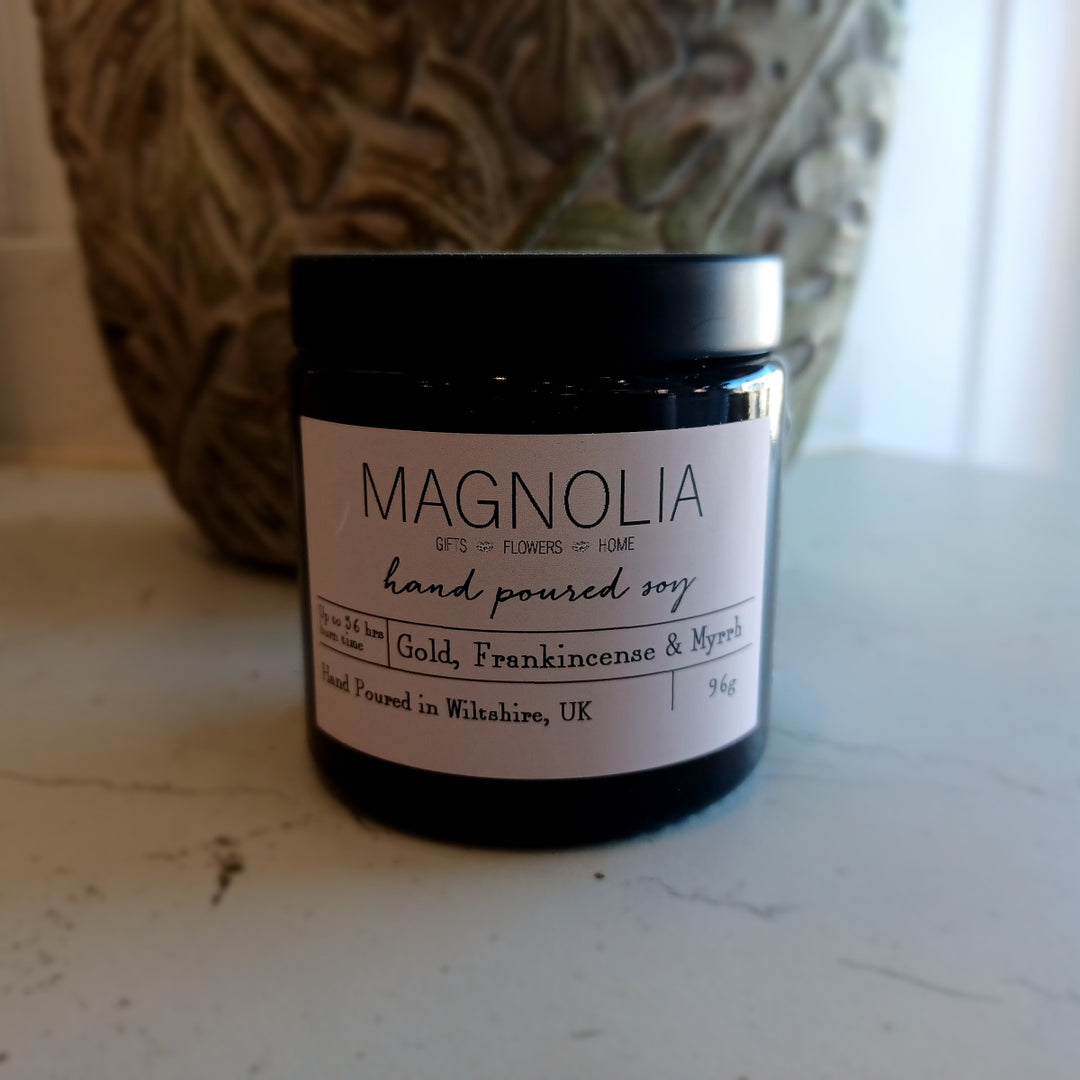 Gold, Frankincense & Myrrh Scented Candle - 96g - Magnolia the Florist Elevate your space with our Gold, Frankincense & Myrrh 96g Scented Jar Candle. The perfect blend of luxurious, fragrant gold, frankincense, and myrrh creates a warm and inviting atmosphere. Enjoy the aromatic benefits while enhancing any room with a touch of elegance, made with a professional blend of scented oil & emollient wax balm.  1