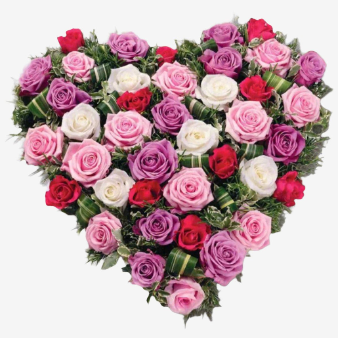 Rose Heart - Magnolia the Florist Large and small-headed Roses and Spray Roses in lilac, cream and pastel pink are nestled into a solid 15" heart shape finished with Dracaena leaves and sprigs of scented Rosemary. If you cannot find what you want on our site, please call our sales team, we're always happy to assist you This item requires 3 days notice to order.  1