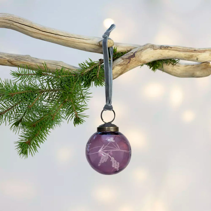 Etched Round Decoration  - Purple - 5cm - Magnolia the Florist Instantly make your Christmas tree more fun with this stylish purple glass bauble. With detailed hand etching that catches the light beautifully, this 5cm decoration packs a larger than expected punch and adds subtle elegance to your festive display. This charming little bauble will hang effortlessly in your tree, quietly helping to make Christmas, Christmas. Dimensions: 5 cm - Glass  1