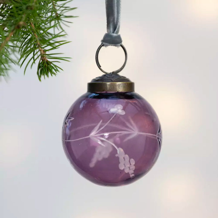 Etched Round Decoration  - Purple - 5cm - Magnolia the Florist Instantly make your Christmas tree more fun with this stylish purple glass bauble. With detailed hand etching that catches the light beautifully, this 5cm decoration packs a larger than expected punch and adds subtle elegance to your festive display. This charming little bauble will hang effortlessly in your tree, quietly helping to make Christmas, Christmas. Dimensions: 5 cm - Glass  2