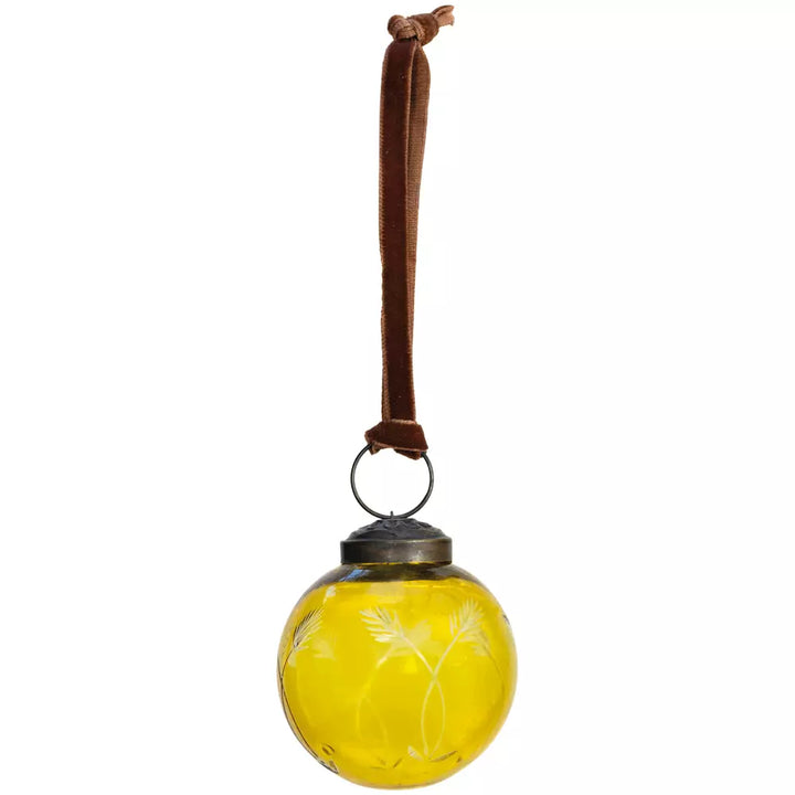 Etched Round Decoration  - Yellow - 5cm - Magnolia the Florist Add a touch of sophistication to your Christmas tree with this exquisite round hanging decoration. Crafted from glass in a charming yellow hue, this bauble features an elegant etched pattern that catches the light beautifully. Measuring 5cm in diameter, it is the perfect size for adding subtle elegance to your festive display. This beautiful bauble is sure to bring warmth and a playful style to your celebrations. Dimensions: 5 cm - Glass  3