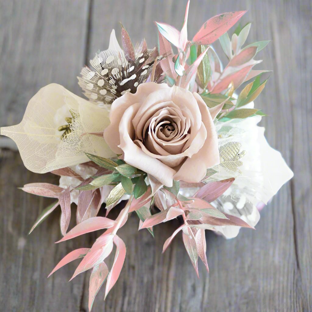 Wrist Corsage - Magnolia the Florist Make the day truly memorable with one of our signature floral wrist corsages featuring a mix of seasonal textures and blooms. All arranged onto a beautiful Peal bracelet.  1