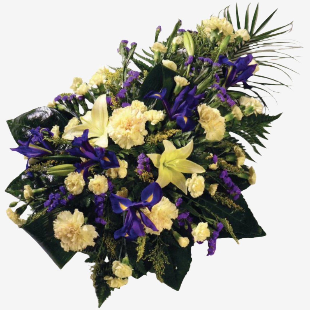Yellow and Purple Single-Ended Spray - Magnolia the Florist This yellow and purple single-ended spray is created with a mixture of Carnations, Irises, Spray Carnations and luxury foliage. Single Ended Sprays have an approximate length of 55 cm. If you cannot find what you want on our site, please call our sales team, we're always happy to assist you This item requires 2 days notice to order.  1