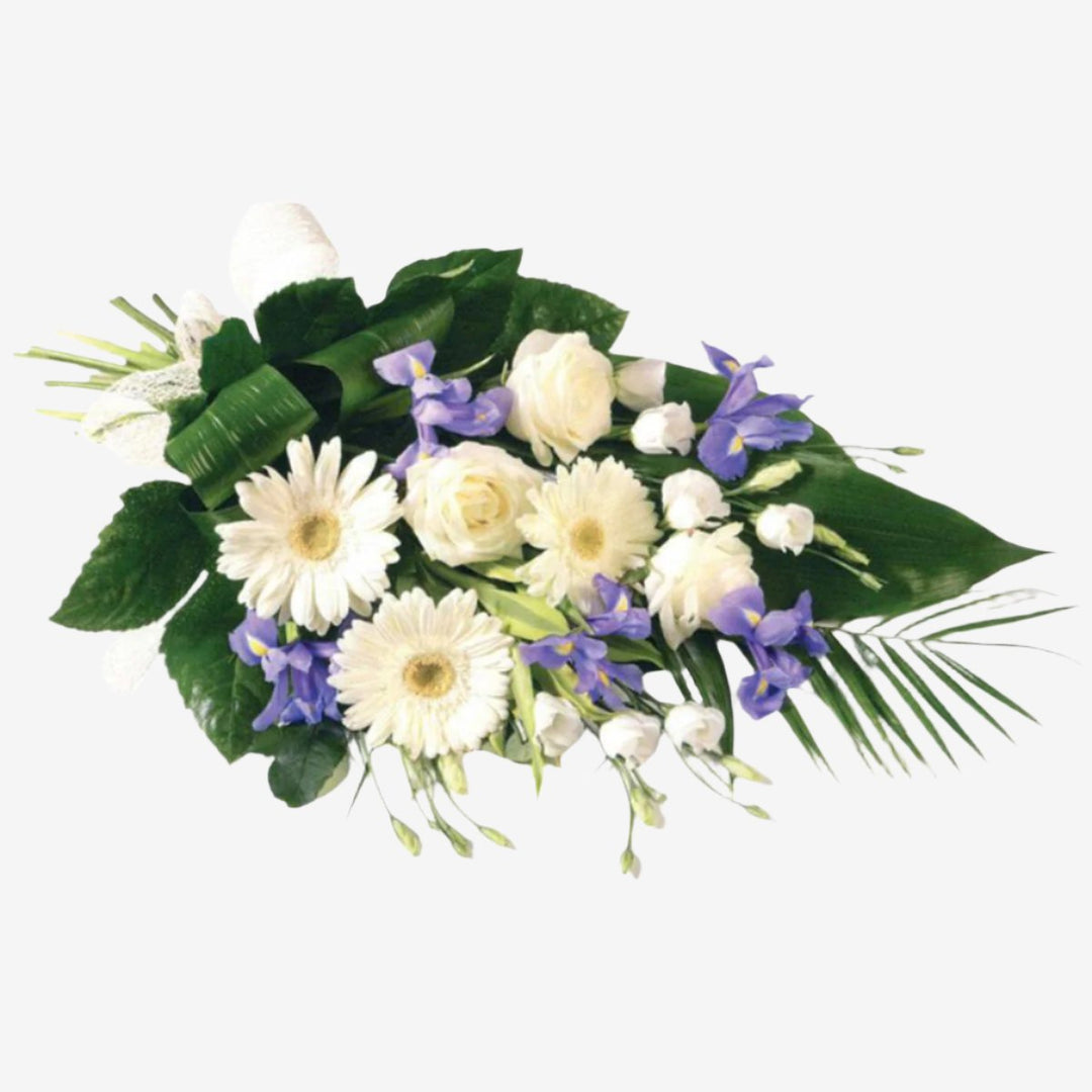 Purple & White Sheaf - Magnolia the Florist The soft blue shades of Iris are complemented by white Germini, large-headed Roses and Lisianthus in this classic sheaf, which is tied together with a natural ribbon. If you cannot find what you want on our site, please call our sales team, we're always happy to assist you. This item requires 2 days notice to order. Appox lenght 45cm  1