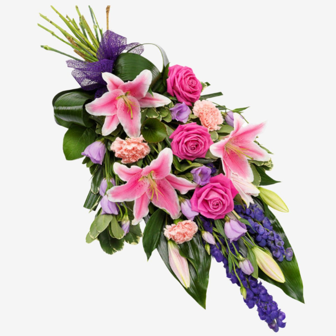 Purple & Pink Sheaf - Magnolia the Florist A gorgeous pink Rose and Lily hand-tied sheaf with lavender Lisianthus, purple Statice and pink Carnations set against Aspidistra and Galax leaves.Please note that the approximate length of hand-tied sheaves is 45cm If you cannot find what you want on our site, please call our sales team, we're always happy to assist you. This item requires 2 days notice to order. Appox lenght 45cm  1