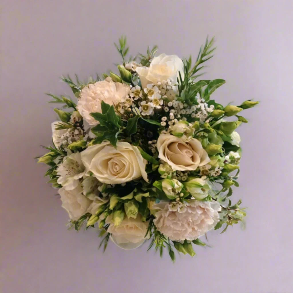 Wild N Free Bridesmaid Bouquet - Magnolia the Florist An abundant bridal bouquet featuring the best blooms the season has to offer.Select your colour palette and we’ll craft a stunning design just for you!  1
