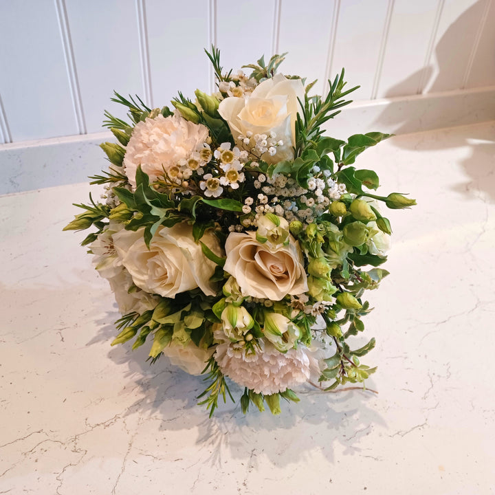 Wild N Free Bridesmaid Bouquet - Magnolia the Florist An abundant bridal bouquet featuring the best blooms the season has to offer.Select your colour palette and we’ll craft a stunning design just for you!  2