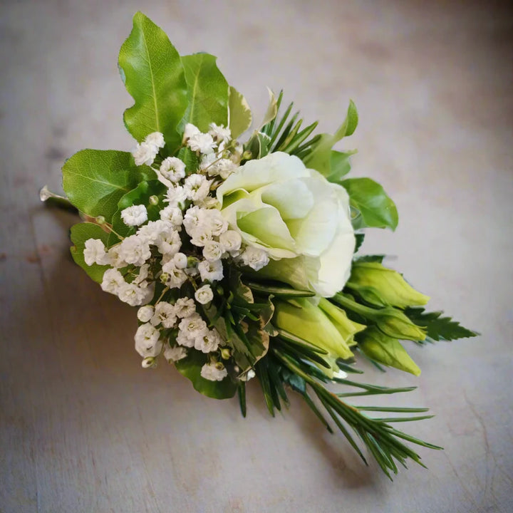 Corsage - Magnolia the Florist Beautiful floral accents to adorn a suit or lapel, featuring a stunning mix of textures and tones. Each boutonniere comes with an easy-pin attachment. Please Note - Buttonholes are made for the day of the event ONLY and will only last around 6-8 hours from attaching to the outfit due to body heat. This item requires 1 day notice to order.  1