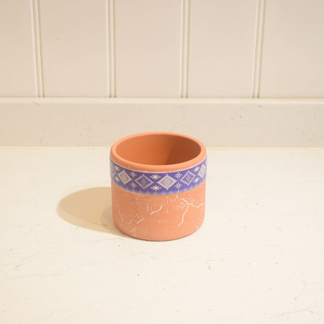 "Aztec" Terracotta Pot -Small - Magnolia the Florist This "Aztec" Terracotta Pot is the ideal accent piece for any indoor space. It has a unique Aztec-style motif and measures 9 cm high by 11 cm wide, so it can comfortably hold a 9 cm wide pot. The terracotta pot is glazed on the inside, making it suitable for indoor use only.  1