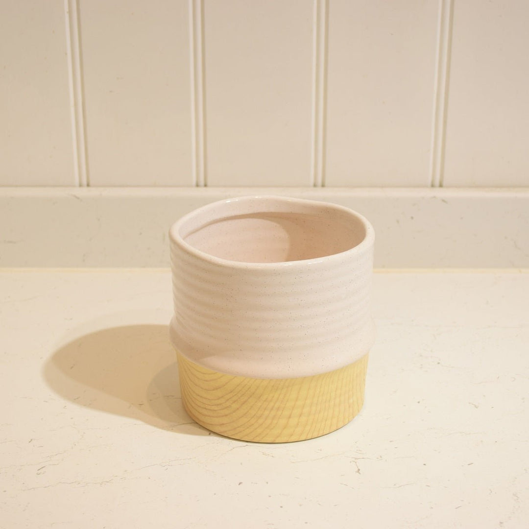 Bamboo Effect Ceramic Pot - Magnolia the Florist A beautiful bamboo effect pot with a coloured top band. The approximate size is 14 centimeters heigh by 13 centimeters. The opening approximately 12cm.  1
