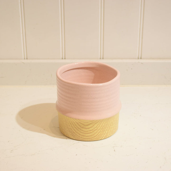 Bamboo Effect Ceramic Pot - Magnolia the Florist A beautiful bamboo effect pot with a coloured top band. The approximate size is 14 centimeters heigh by 13 centimeters. The opening approximately 12cm.  3