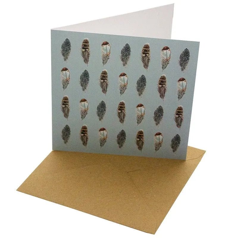 Blue Feathers Bird Greetings Card - Magnolia the Florist Gift your loved ones a beautiful Blue Feathers Greetings Card that will make any occasion special. This 148mm square card is made with a sustainable, 100% recycled unbleached 350gsm paper. The featured feather design with a blank interior for a personal message makes it a perfect choice for any special day.  1