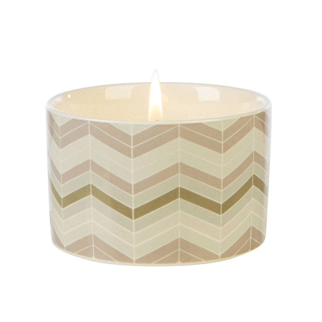 Fired Earth Candle Medium Ceramic Darjeeling & Damask Rose - Magnolia the Florist Featuring a beautiful Fired Earth chevron design, this ceramic Medium Candle from Wax Lyrical blends floral notes of oud, rose, geranium and jasmine with a velvety base of cedarwood and amber to create a delightful scent for the home. Enjoy up to 26 hours of burn time.  1