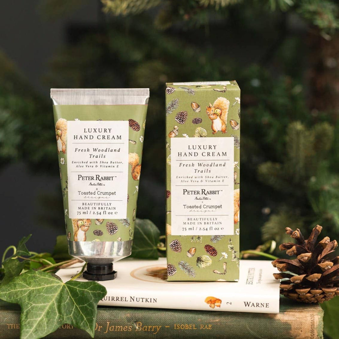 Squirrel Nutkin "Fresh Woodland Trails" Luxury Hand Cream - Magnolia the Florist Introducing the Squirrel Nutkin "Fresh Woodland Trails" Luxury Hand Cream from the Peter Rabbit Collection by Toasted Crumpet. This 75ml hand cream offers an enchanting journey into the heart of British nature. Enjoy the luxury of a moisturizing hand cream that brings the beauty of the outdoors, indoors. This product is proudly made exclusively in Britain.  1