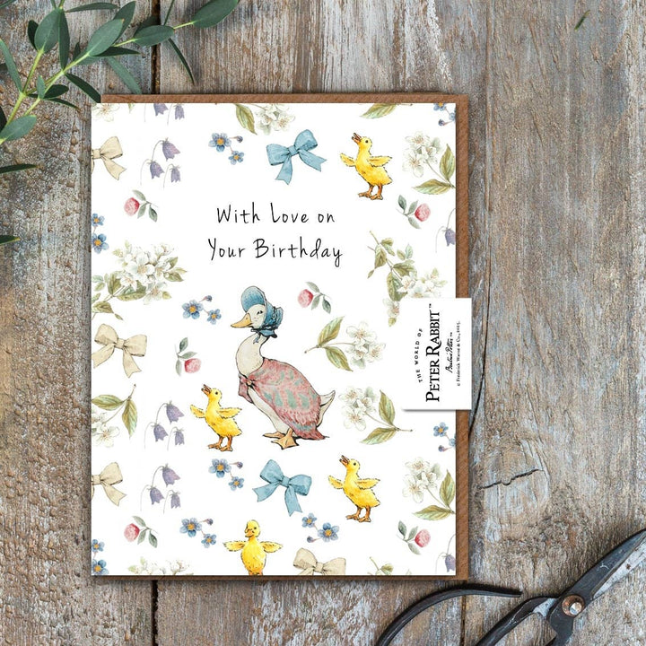 Love on Your Birthday (Jemima Puddle-Duck) Card - Magnolia the Florist Send your birthday wishes with this charming Love On Your Birthday Jemima Puddle-Duck Card, featuring the beloved Beatrix Potter character. Perfect for someone special, this beautifully illustrated card adds a thoughtful finishing touch to any gift or flower delivery. Size is 108 × 140 mm • Blank inside • Includes kraft envelope  2