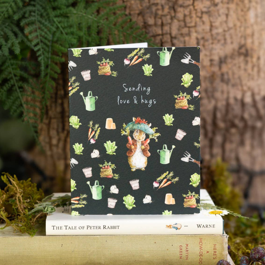 Sending Love &amp; Hugs (Benjamin Bunny) Card - Magnolia the Florist A sweet Benjamin Bunny mini card to send love and hugs — finished with luxe gold‑foiled debossing and printed on beautifully textured, fully recyclable card. A thoughtful little add‑on for your flowers. Size is 108 × 120 mm • Blank inside • Includes white envelope  1