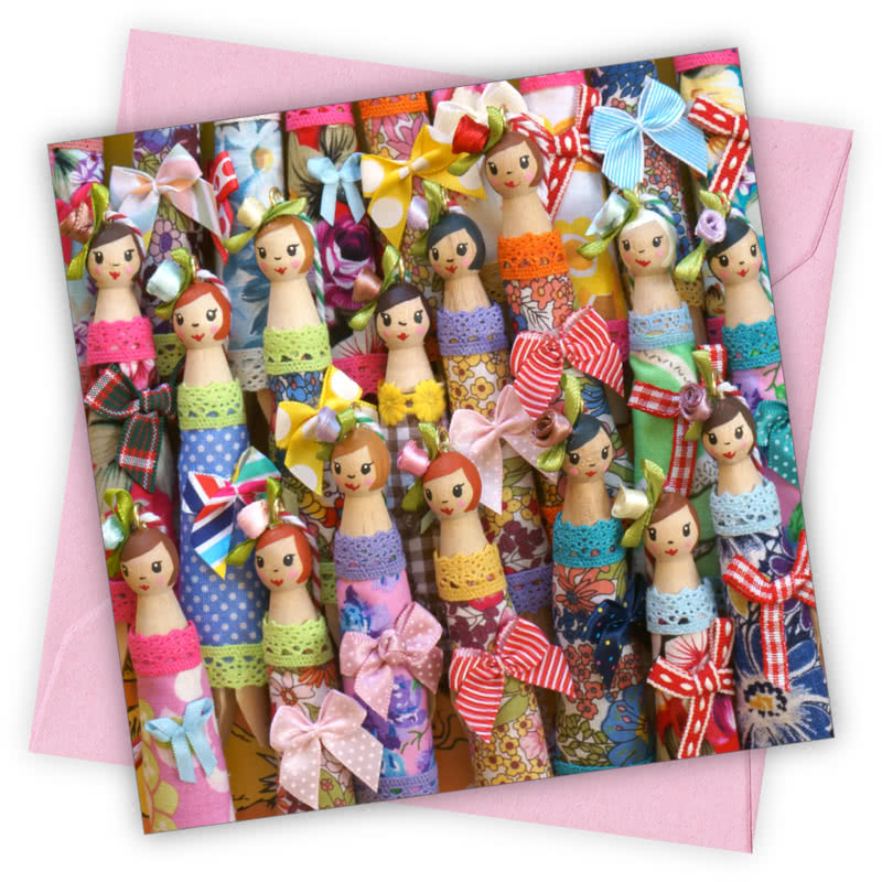 Peg Dolls Greetings Card - Magnolia the Florist Individual greeting card and envelope. Blank inside for your personal message Supplied with a colour co-ordinated envelope Envelope colour: Pink High-quality (300gsm) matt finish card Printed in the UK. Size: 100mm × 100m  1