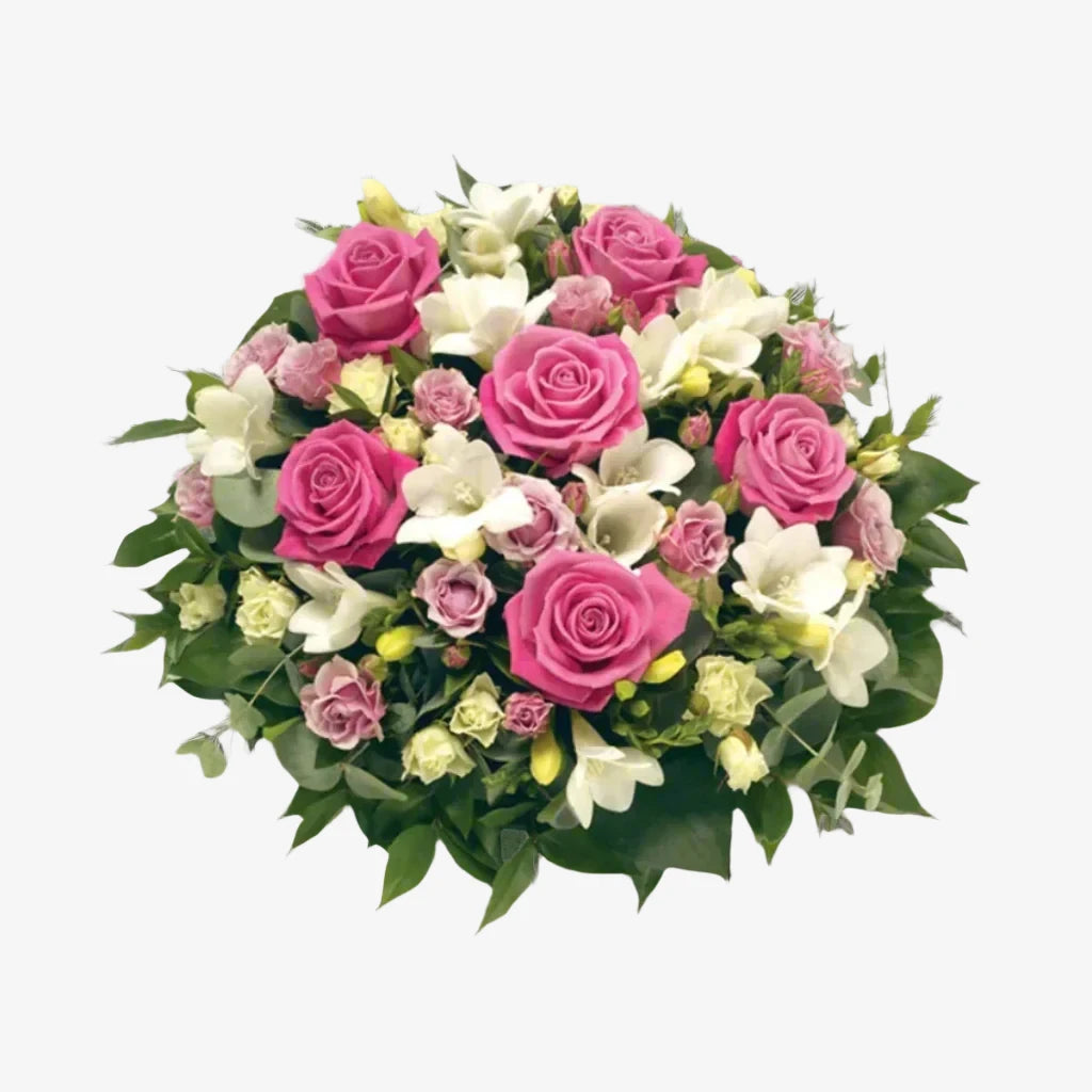 Rose & Freesia Posy - Magnolia the Florist This funeral posy features delicate pink roses and elegant white freesia, creating a beautiful and respectful tribute to a loved one. The combination of these flowers evokes emotions of grace and remembrance, making it a fitting offering for a funeral or memorial service. If you cannot find what you want on our site, please call our sales team, we're always happy to assist you This item requires 2 days notice to order.  1