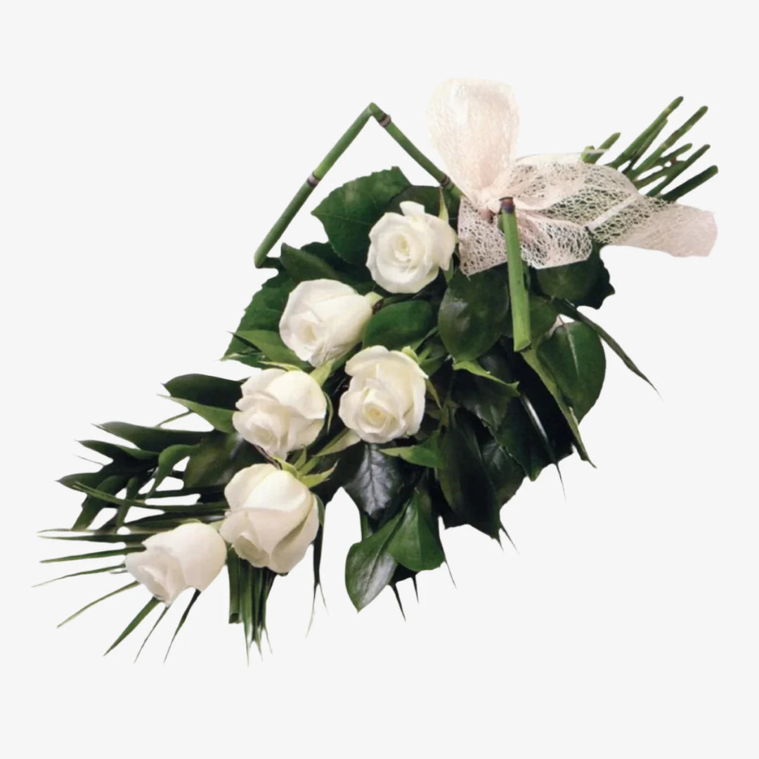 6 Rose Sheaf - Magnolia the Florist 6 large-headed Roses are presented with Fatsia, Palm and Ruscus leaves to create this simple, classic Rose sheaf. The image shows the colour option of White, although other options are available. Please select your colour option below. If you cannot find what you want on our site, please call our sales team, we're always happy to assist you. This item requires 1 day notice to order. Appox lenght 45cm  1