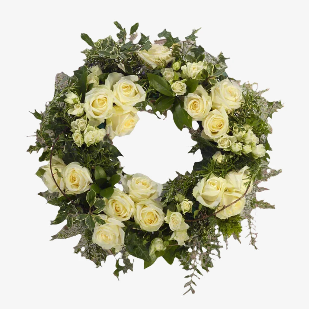 Rose Wreath - Magnolia the Florist Large-headed roses are used to create this special tribute, with spray roses and foliage to compliment the beautiful roses. This design is available in other colour options, please select which option you would like. If you cannot find what you want on our site, please call our sales team, we're always happy to assist you This item requires 2 days notice to order.  1
