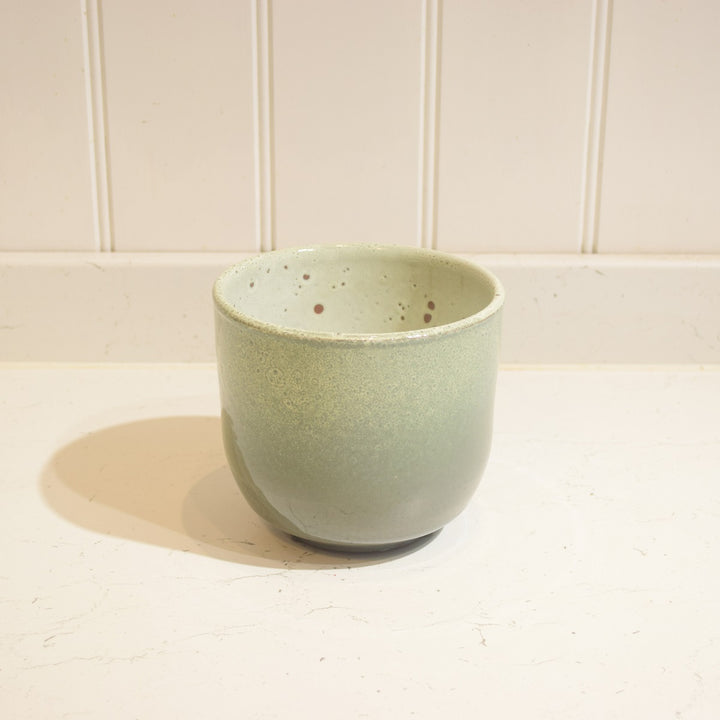 Minsk Ceramic Pot - Small - Magnolia the Florist The Minsk Ceramic Pot is an elegant home addition, specially designed for indoor use. It features a 14 cm wide opening and 13 cm height, capable of holding a 12 cm pot. The pot is constructed from high-quality ceramic and fully glazed for durability and aesthetic appeal. A perfect choice for your home or office.  1