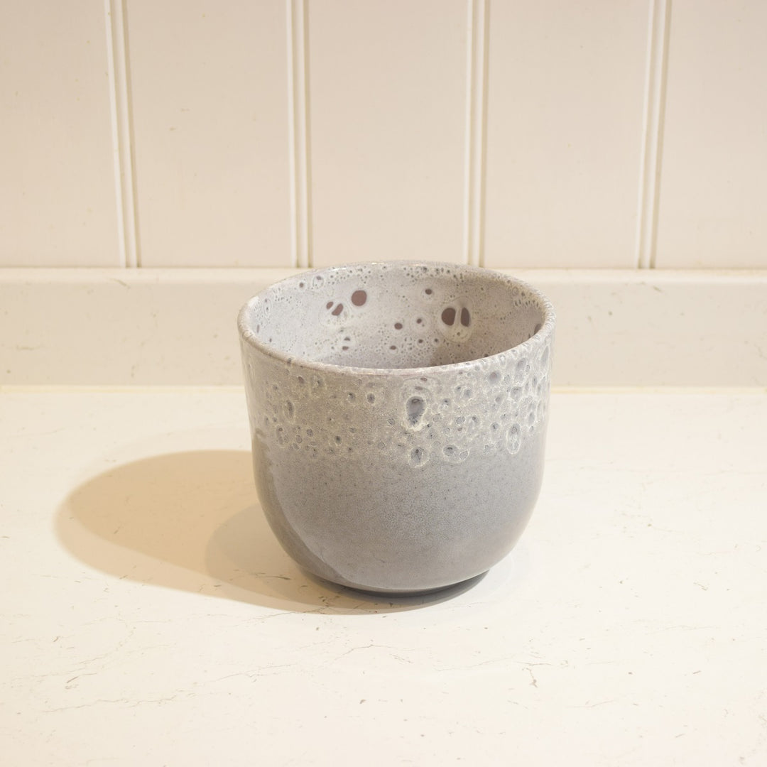 Minsk Ceramic Pot - Small - Magnolia the Florist The Minsk Ceramic Pot is an elegant home addition, specially designed for indoor use. It features a 14 cm wide opening and 13 cm height, capable of holding a 12 cm pot. The pot is constructed from high-quality ceramic and fully glazed for durability and aesthetic appeal. A perfect choice for your home or office.  2