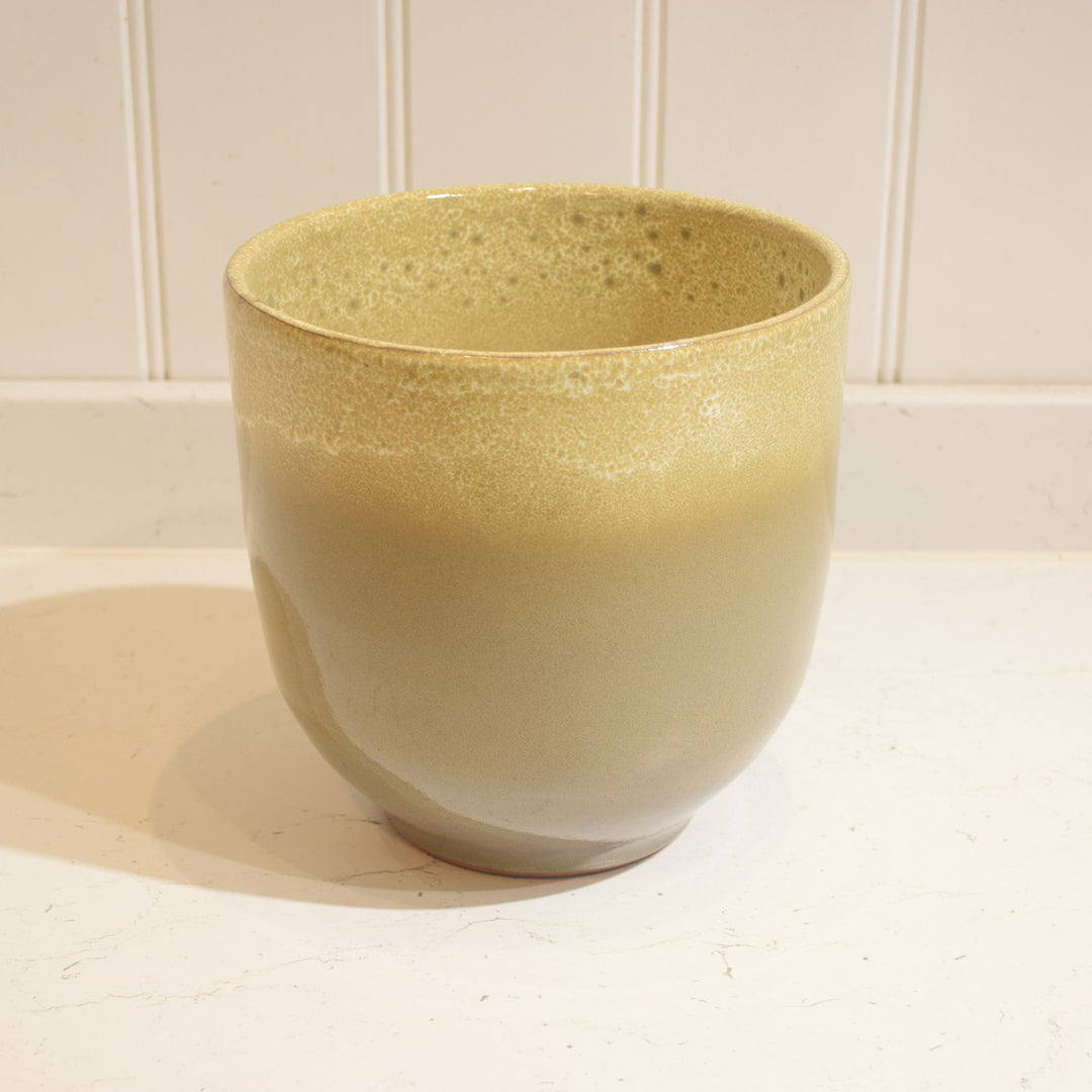 Minsk Ceramic Pot - Large - Magnolia the Florist The Minsk Ceramic Pot is an elegant home addition, specially designed for indoor use. It features a 19 cm wide opening and 18 cm height, capable of holding an 18 cm pot. The pot is constructed from high-quality ceramic and fully glazed for durability and aesthetic appeal. A perfect choice for your home or office.  2