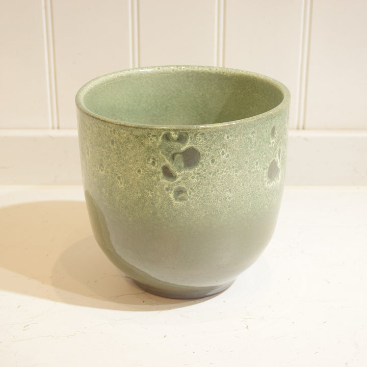 Minsk Ceramic Pot - Large - Magnolia the Florist The Minsk Ceramic Pot is an elegant home addition, specially designed for indoor use. It features a 19 cm wide opening and 18 cm height, capable of holding an 18 cm pot. The pot is constructed from high-quality ceramic and fully glazed for durability and aesthetic appeal. A perfect choice for your home or office.  1