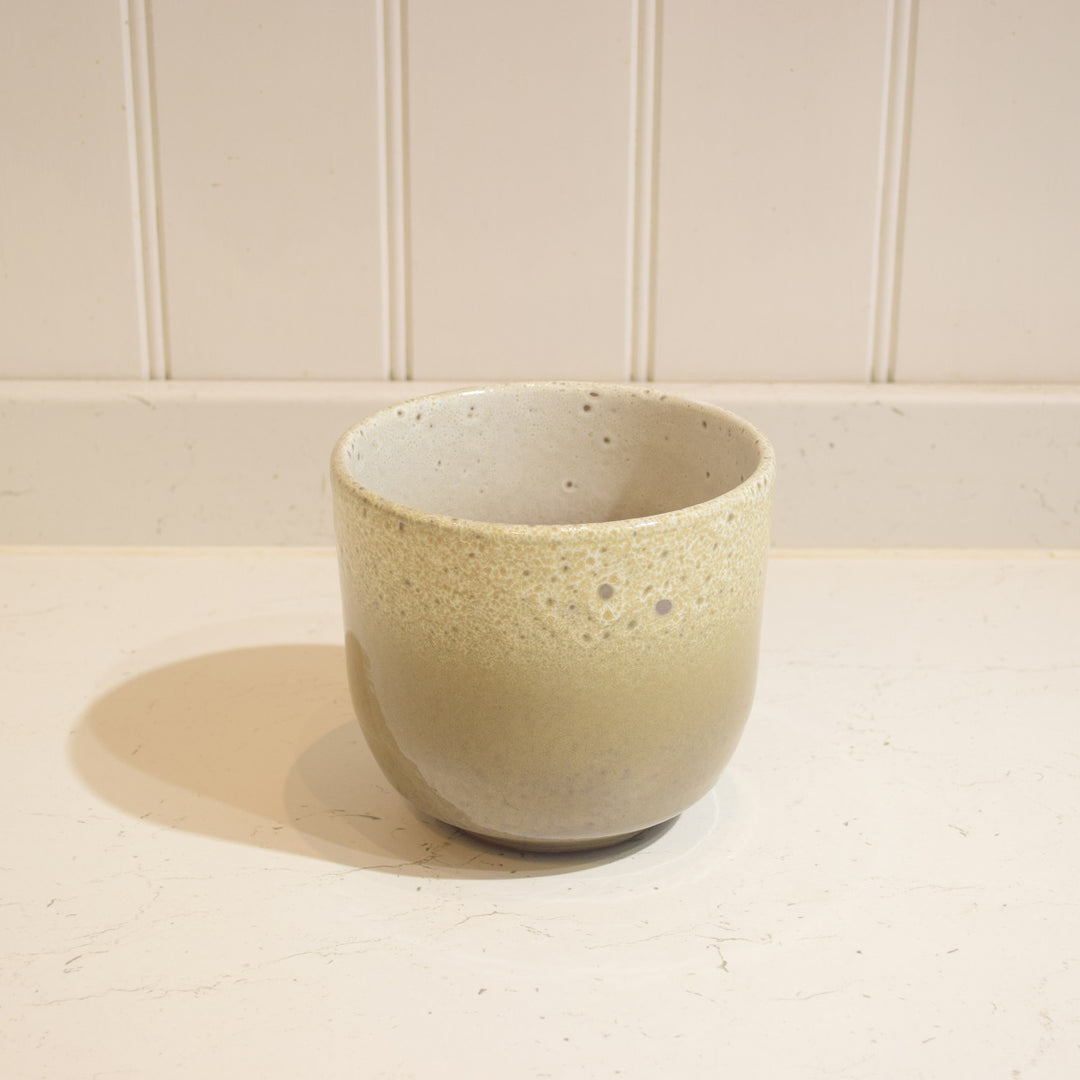 Minsk Ceramic Pot - Small - Magnolia the Florist The Minsk Ceramic Pot is an elegant home addition, specially designed for indoor use. It features a 14 cm wide opening and 13 cm height, capable of holding a 12 cm pot. The pot is constructed from high-quality ceramic and fully glazed for durability and aesthetic appeal. A perfect choice for your home or office.  3