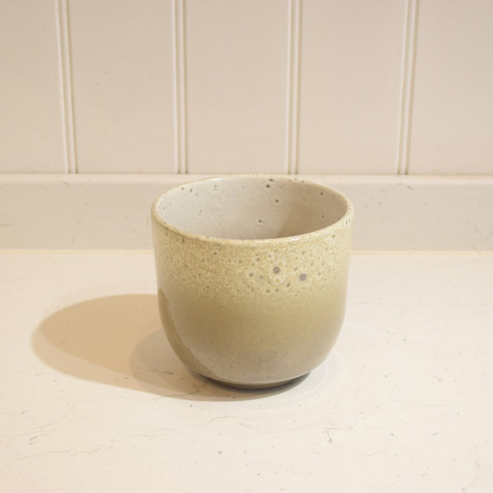 Minsk Ceramic Pot - Small - Magnolia the Florist The Minsk Ceramic Pot is an elegant home addition, specially designed for indoor use. It features a 14 cm wide opening and 13 cm height, capable of holding a 12 cm pot. The pot is constructed from high-quality ceramic and fully glazed for durability and aesthetic appeal. A perfect choice for your home or office.  3