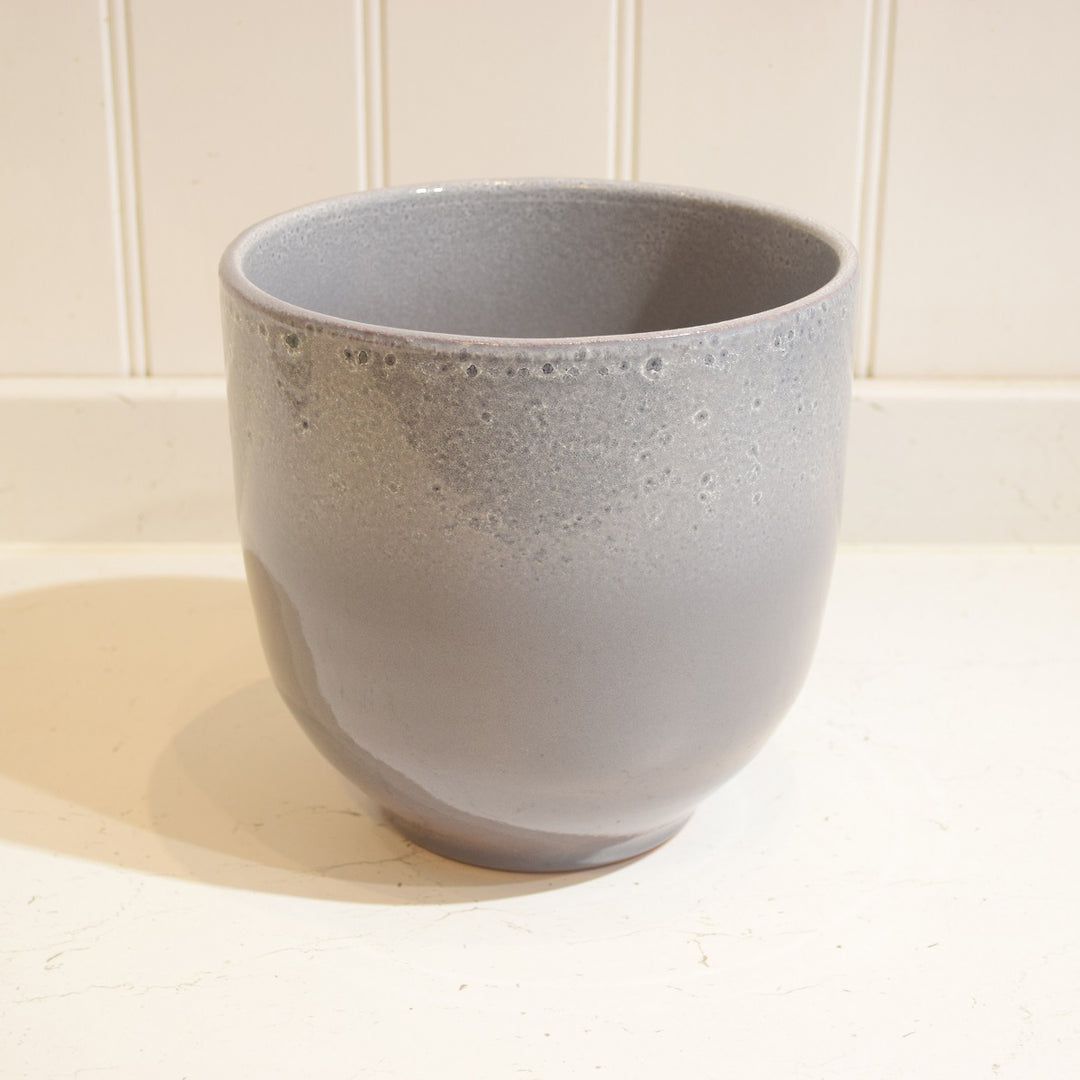 Minsk Ceramic Pot - Large - Magnolia the Florist The Minsk Ceramic Pot is an elegant home addition, specially designed for indoor use. It features a 19 cm wide opening and 18 cm height, capable of holding an 18 cm pot. The pot is constructed from high-quality ceramic and fully glazed for durability and aesthetic appeal. A perfect choice for your home or office.  3